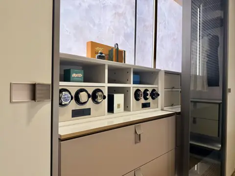Built-in watch winders and backlit onyx panel