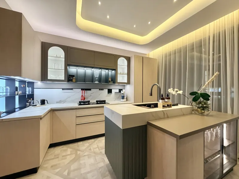 Modenzo kitchen with island, white marble worktops and arched glass cabinets, real photo